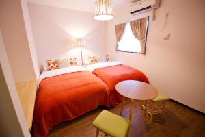 Ένα ή περισσότερα κρεβάτια σε δωμάτιο στο Kurarisu2 RoomC