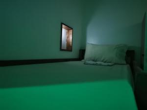 Postel nebo postele na pokoji v ubytování One Hostel - El Nido