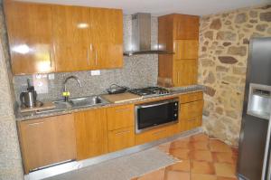 
A cozinha ou kitchenette de Alojamento Faria - Casa no campo em Esposende
