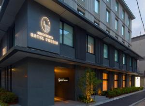 a building with a sign that reads hotel fusion at Shizutetsu Hotel Prezio Kyoto Shijo in Kyoto