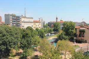 a city with a park and trees and buildings at Hotel Mozart in Milan