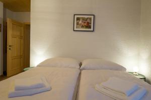 A bed or beds in a room at Wellness privát Štyri Lipy
