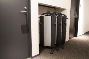 a row of lockers in a locker room at Shizutetsu Hotel Prezio Kyoto Shijo in Kyoto