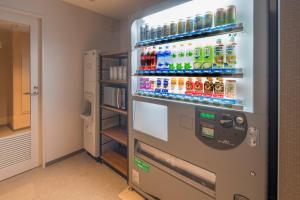 a vending machine filled with lots of drinks at Shizutetsu Hotel Prezio Kyoto Shijo in Kyoto