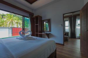 Postel nebo postele na pokoji v ubytování Tyga Pool Villa Aonang Krabi + 23 fotografií