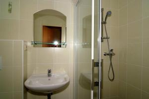 Koupelna v ubytování Hotel KAMU GARNI