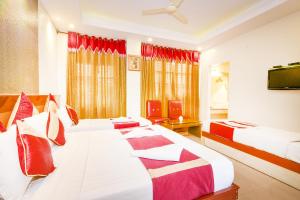 Krevet ili kreveti u jedinici u okviru objekta Aishwarya Residency