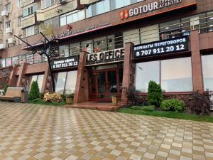 a store front of a building in a city at LES Mini Hotel in Almaty