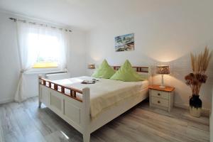 Voodi või voodid majutusasutuse Zur Alten Boddenfischerei Ferienwohnung Zander toas