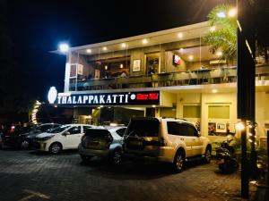 a parking lot with cars parked in front of a building at Visakha 6 in Colombo