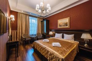 Кровать или кровати в номере Эрмитаж Бутик-Отель