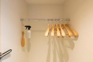 a group of baseball bats hanging on a wall at Shizutetsu Hotel Prezio Kyoto Shijo in Kyoto
