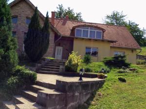 a house with stairs in front of it at Apartments for Rent near Budapest in Etyek