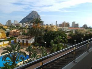 a view of a city with a mountain in the background at The Cookbook Gastro Boutique Hotel & SPA in Calpe