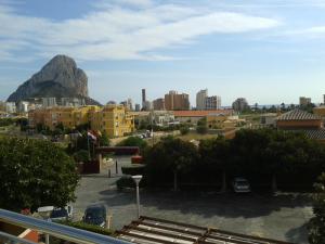 a view of a city with a mountain in the background at The Cookbook Gastro Boutique Hotel & SPA in Calpe