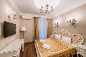 Tempat tidur dalam kamar di Nordian Classic in Kyiv