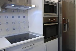 Kuchyň nebo kuchyňský kout v ubytování El Rincon de Elena (Garden Apartment)