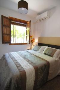 En eller flere senger på et rom på El Rincon de Elena (Garden Apartment)