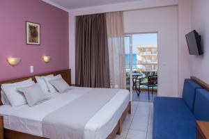 Ένα ή περισσότερα κρεβάτια σε δωμάτιο στο Sunny Bay Hotel