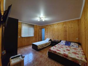 Ένα ή περισσότερα κρεβάτια σε δωμάτιο στο Guesthouse Kurortnaya 46