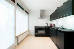 Kuchyň nebo kuchyňský kout v ubytování Appartements Hofquartier