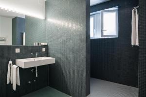 Koupelna v ubytování Appartements Hofquartier