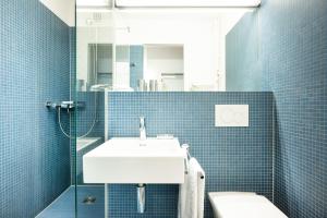 Koupelna v ubytování Appartements Hofquartier