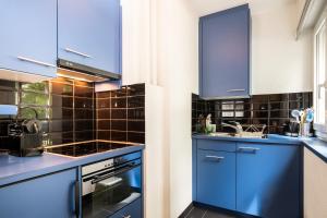 Kuchyň nebo kuchyňský kout v ubytování Appartements Hofquartier