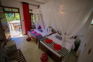 Postel nebo postele na pokoji v ubytování Snuggle Cottage