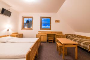 Postel nebo postele na pokoji v ubytování Horský Hotel Kohútka
