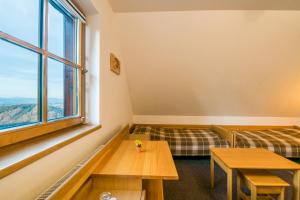 Postel nebo postele na pokoji v ubytování Horský Hotel Kohútka