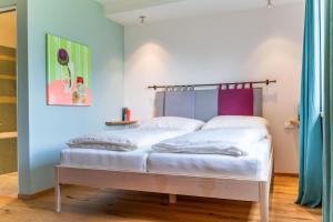 Postel nebo postele na pokoji v ubytování Alpinikum Apartments