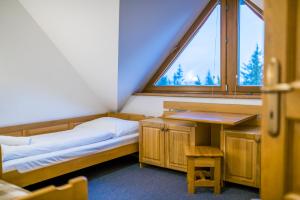 Postel nebo postele na pokoji v ubytování Horský Hotel Kohútka