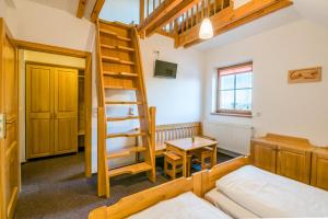 Postel nebo postele na pokoji v ubytování Horský Hotel Kohútka