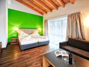 Postel nebo postele na pokoji v ubytování Hotel Garni Alpenland