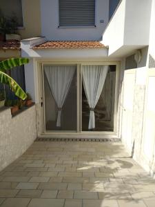 Balkón nebo terasa v ubytování ORISTANO CAMERA BLU max 2 pers, BAGNO E USO CUCINA