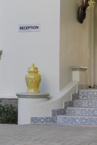 a vase is sitting on the side of a staircase at Monte Vista Boutique Hotel in Montagu