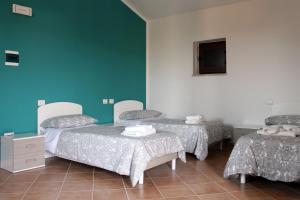 Postel nebo postele na pokoji v ubytování Albergo Diffuso di Campolattaro
