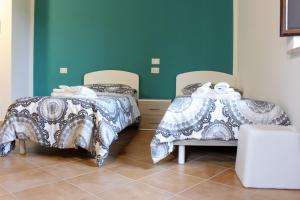 Postel nebo postele na pokoji v ubytování Albergo Diffuso di Campolattaro