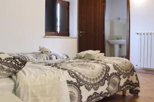 Postel nebo postele na pokoji v ubytování Albergo Diffuso di Campolattaro