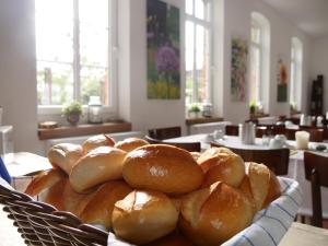 a basket of bread sitting on a table at Bleckmanns Hof in Werne an der Lippe