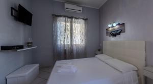 Postel nebo postele na pokoji v ubytování Albachiara Guest House