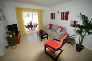 a living room with a couch and a chair at Casa Lola in Agaete