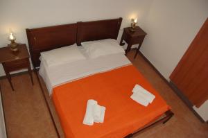 Voodi või voodid majutusasutuse Hotel Al Togo Fitness & Relax toas
