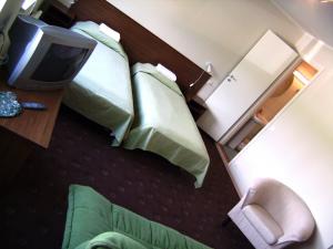 Voodi või voodid majutusasutuse Hotell Sõnajala toas