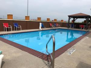 a large swimming pool on top of a building at Days Inn & Suites by Wyndham Thibodaux in Thibodaux