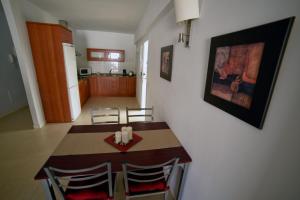 a kitchen and dining room with a table and chairs at Casa Lola in Agaete