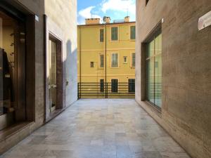 a hallway with a yellow building in the background at LIGURIA HOLIDAYS - "La Casa di Gisella" in Camogli