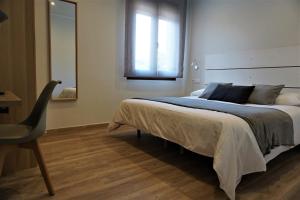 Postel nebo postele na pokoji v ubytování Apartamentos La Playina