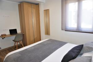 Postel nebo postele na pokoji v ubytování Apartamentos La Playina